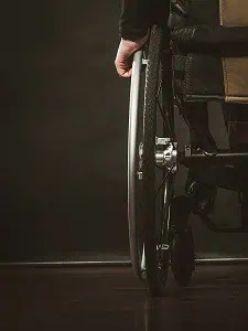 Disabled Person Sitting On Wheelchair